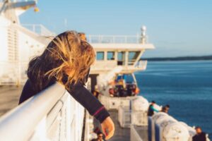 person on the rail of a bc ferry