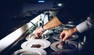 chef plating dishes in a restaurant