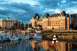 heritage Empress Hotel lit by the sunset in the Inner Harbour Victoria BC