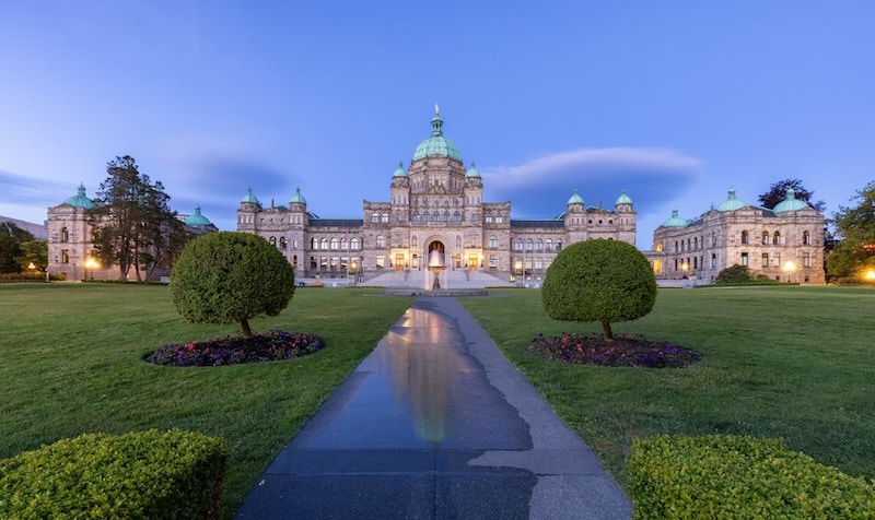 front view of the walkway, fountain and facade of the Legislative Building in Victoria BC