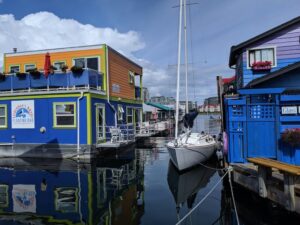 bright blue and yellow float homes in Fisherman's Wharf, Victoria BC