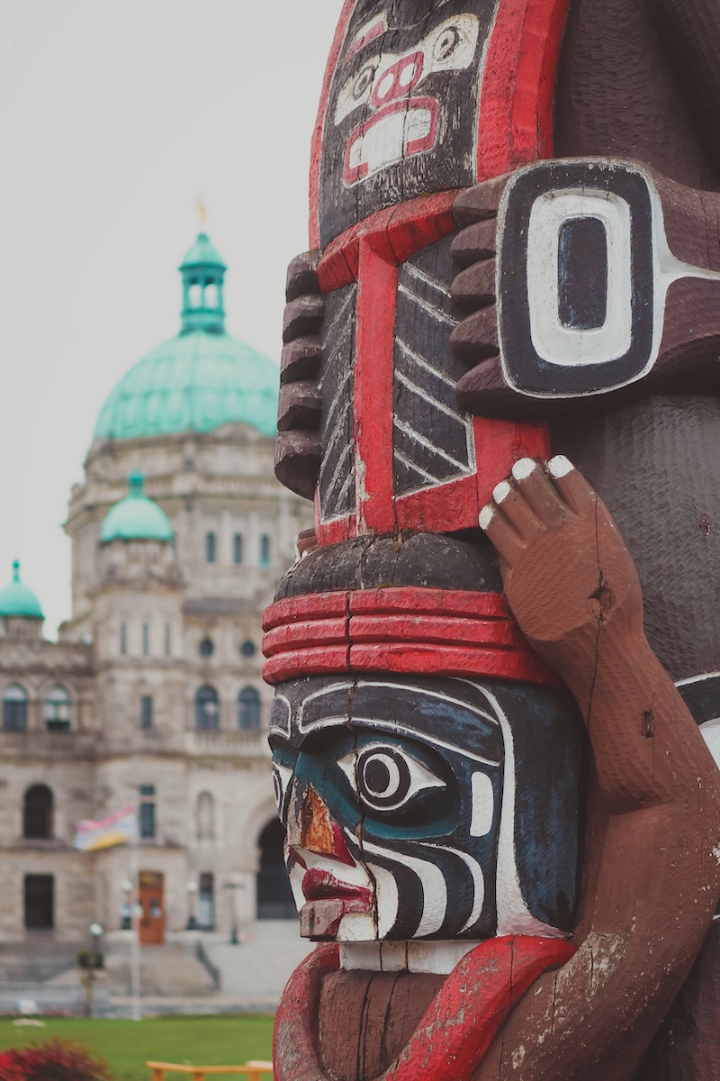 Parliament Buildings with Coast Salish totem in foreground