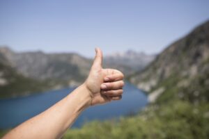 Thumbs up to a beautiful mountain view