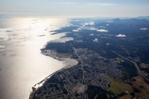 Aerial view of a small town, Parksville, on Vancouver Island during a sunny summer morning. Taken near Nanaimo, British Columbia, Canada.