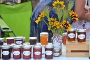 farmers market stand selling fresh jam